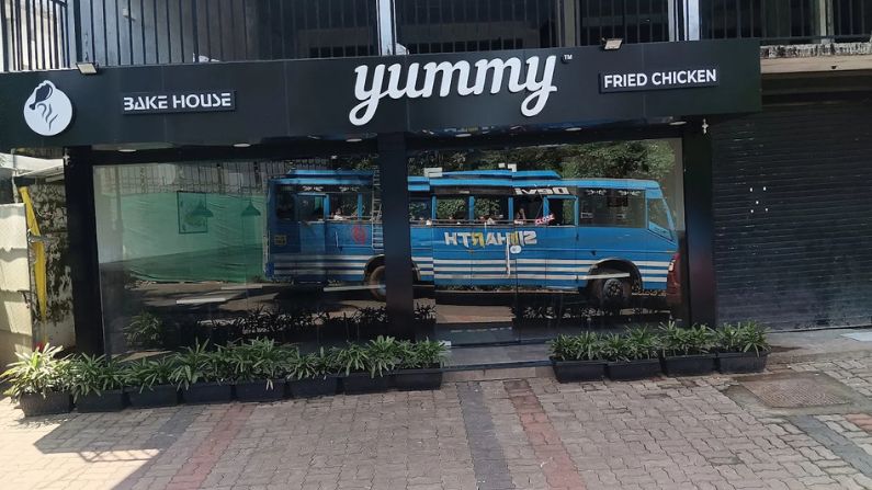 Exterior view of Bake House Yummy Fried Chicken, a popular fast-food spot among restaurants in Panoor.