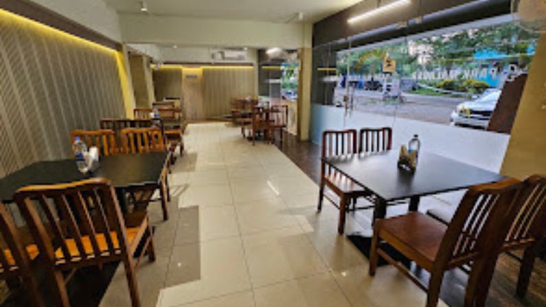 Dining area at Park Malabar Restaurant with Kerala and Malabar dishes.